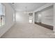 Spacious living room with ample natural light and an open layout, perfect for entertaining at 12710 Es Draper Dr, Huntersville, NC 28078