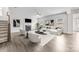Modern living room with fireplace, ceiling fan and comfortable seating at 12710 Es Draper Dr, Huntersville, NC 28078