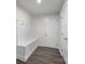Mudroom featuring a built-in bench with hooks and storage cabinets at 12710 Es Draper Dr, Huntersville, NC 28078