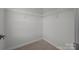 Walk-in closet featuring carpeted floor and wire shelving at 12710 Es Draper Dr, Huntersville, NC 28078