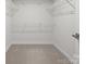Walk-in closet with carpet and white wire shelving at 12710 Es Draper Dr, Huntersville, NC 28078