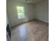 Inviting bedroom with new flooring and a large window at 132 Loomis St, Chester, SC 29706