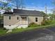 Charming single-story home with neutral siding, new roof, and inviting front porch at 132 Loomis St, Chester, SC 29706