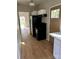Functional kitchen featuring stainless steel appliances and access to a bright living area at 132 Loomis St, Chester, SC 29706