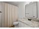 Bathroom features a granite vanity, tile floors, and shower with curtain at 1409 Rheo Nw Ct, Concord, NC 28027