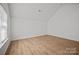 This bedroom features a large window with natural light and wood-look floors at 1409 Rheo Nw Ct, Concord, NC 28027