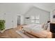 Bright bedroom with vaulted ceiling, natural light, a comfortable bed, and wood-look floors at 1409 Rheo Nw Ct, Concord, NC 28027