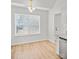Eat-in kitchen area features a modern chandelier and natural light at 1409 Rheo Nw Ct, Concord, NC 28027