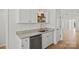 The kitchen features granite countertops, a stainless steel dishwasher, and stylish open shelving at 1409 Rheo Nw Ct, Concord, NC 28027