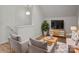 Cozy living area with comfortable seating, a television, and lots of natural light at 1409 Rheo Nw Ct, Concord, NC 28027