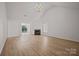 Spacious living room features vaulted ceiling, hardwood floors, and fireplace at 1409 Rheo Nw Ct, Concord, NC 28027