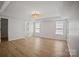 Spacious main bedroom features recessed lights, tray ceiling and two windows providing lots of natural light at 1409 Rheo Nw Ct, Concord, NC 28027