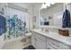 Bathroom featuring a shower with colorful curtain, a sink, and a vanity at 1497 Tranquility Blvd # 417, Lancaster, SC 29720