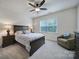 Comfortable bedroom with a bed, a window, and two nightstands with lamps at 1497 Tranquility Blvd # 417, Lancaster, SC 29720