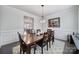 Formal dining room with crown molding, decorative chandelier, and wood table with seating for six at 1497 Tranquility Blvd # 417, Lancaster, SC 29720