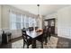 Dining room with a wood table, chandelier, and large window for natural light at 1497 Tranquility Blvd # 417, Lancaster, SC 29720