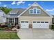 Charming two-story home with a landscaped front yard and a two-car garage, perfect for Gathering living at 1497 Tranquility Blvd # 417, Lancaster, SC 29720