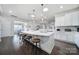 Bright kitchen featuring a large center island, pendant lighting, and hardwood floors at 1497 Tranquility Blvd # 417, Lancaster, SC 29720