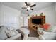 Bright living room with hardwood floors, comfortable seating, and a large entertainment center at 1497 Tranquility Blvd # 417, Lancaster, SC 29720