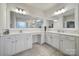 Spacious bathroom featuring double vanity sinks, large mirrors and modern lighting at 1497 Tranquility Blvd # 417, Lancaster, SC 29720