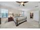 Bright main bedroom features large windows, neutral carpeting, and a walk-in closet at 1497 Tranquility Blvd # 417, Lancaster, SC 29720
