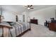 Spacious main bedroom with ceiling fan, walk-in closet, and neutral decor at 1497 Tranquility Blvd # 417, Lancaster, SC 29720