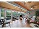 Large sunroom featuring wood-paneled ceiling, hardwood floors and multiple chairs at 1497 Tranquility Blvd # 417, Lancaster, SC 29720