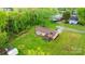 A peaceful home is surrounded by lush greenery and a generous lawn on a sunny day at 1500 19Th Avenue Ne Pl, Hickory, NC 28601