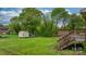 Beautiful backyard with lush green grass, wooden deck, and shed at 1500 19Th Avenue Ne Pl, Hickory, NC 28601