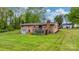 This brick home boasts a spacious backyard, wooden deck, and convenient garage access at 1500 19Th Avenue Ne Pl, Hickory, NC 28601