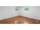 Cozy bedroom with hardwood floors, natural light streaming through the windows, and neutral walls at 1500 19Th Avenue Ne Pl, Hickory, NC 28601