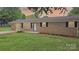 Cozy brick home with bright white door and well-kept lawn at sunset at 1500 19Th Avenue Ne Pl, Hickory, NC 28601