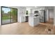 Bright, updated kitchen with stainless steel appliances and a view to a deck outside at 1500 19Th Avenue Ne Pl, Hickory, NC 28601