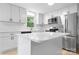 Modern kitchen featuring white cabinets, stainless steel appliances, and a kitchen island at 1500 19Th Avenue Ne Pl, Hickory, NC 28601