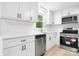 Modern kitchen with white cabinets, stainless steel appliances, and updated countertops at 1500 19Th Avenue Ne Pl, Hickory, NC 28601