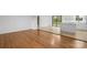 Open living room featuring sleek light hardwood floors and a smooth transition to the kitchen at 1500 19Th Avenue Ne Pl, Hickory, NC 28601
