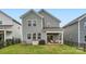 Rear view of home showing a fenced yard, porch and gray siding at 15116 Caspian Way, Charlotte, NC 28278