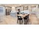 Eat-in kitchen features stainless appliances, ample counter space, and open layout to living and dining at 15116 Caspian Way, Charlotte, NC 28278