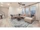 Bright living room with a large sectional sofa, stylish rug, and plenty of natural light at 15116 Caspian Way, Charlotte, NC 28278