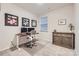 Bright home office with a modern sit-stand desk, comfortable chair, and stylish decor for a productive workspace at 15116 Caspian Way, Charlotte, NC 28278