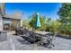 Backyard patio with dining area, grill, and lush green trees at 152 Blossom Ridge Dr, Mooresville, NC 28117