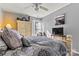 Relaxing bedroom featuring patterned bedding, a ceiling fan, and natural light at 152 Blossom Ridge Dr, Mooresville, NC 28117