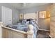 Inviting bedroom with a white bed frame, patterned bedding, and a neutral color scheme at 152 Blossom Ridge Dr, Mooresville, NC 28117
