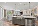 Open-concept kitchen with stainless steel appliances, granite counters, and adjacent dining and living spaces at 152 Blossom Ridge Dr, Mooresville, NC 28117