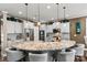 Kitchen featuring a large island with granite countertops, stainless steel appliances, and seating for casual dining at 152 Blossom Ridge Dr, Mooresville, NC 28117