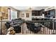 Cozy loft area with dark cabinetry, wet bar, comfortable seating, and movie-themed decor at 152 Blossom Ridge Dr, Mooresville, NC 28117
