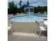 Fun splash pad and wading pool area perfect for young children, along with tables and chairs for relaxing at 152 Blossom Ridge Dr, Mooresville, NC 28117