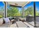Relaxing screened porch with comfortable seating and serene outdoor views at 152 Blossom Ridge Dr, Mooresville, NC 28117