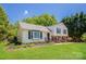 Charming home featuring manicured front lawn, beautiful landscaping, and a classic facade at 1637 Buckingham Ave, Gastonia, NC 28054