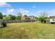 Large backyard showing the home's exterior and mature trees, with privacy fencing at 1766 Colony Rd, Rock Hill, SC 29730